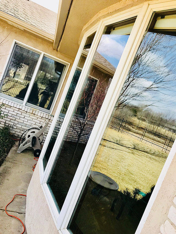 exterior windows after cleaning on beige home